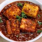 dhaba style paneer masala is served in a pan