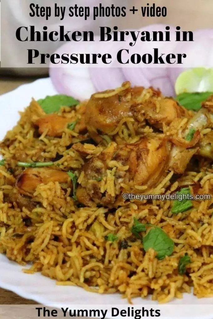 chicken biryani made in pressure cooker served on a white colred plate with onion slices and lemon wedges.