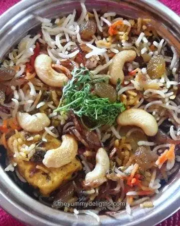 close up of veg biryani in a serving bowl.