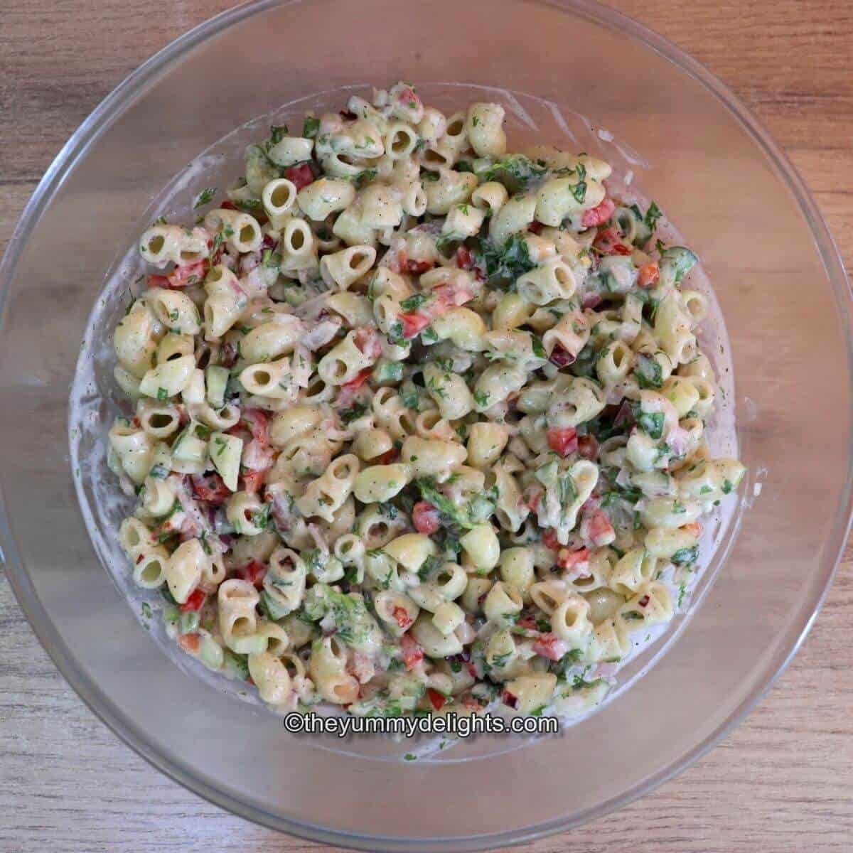 Creamy macaroni Salad in a glass bowl.