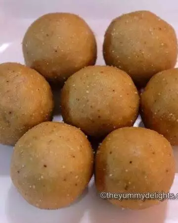Peanut ladoos placed on a white plate.