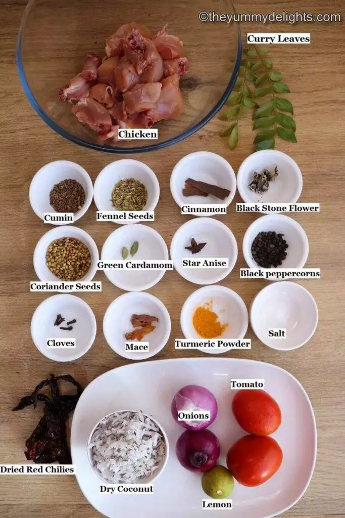 individually labeled ingredients to make Chicken Chettinad recipe are laid out on a table.