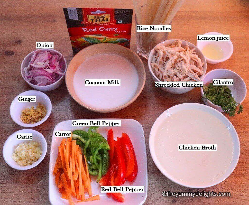 individually labeled ingredients to make Thai chicken noodle soup are laid out on a table.