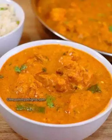 boneless chicken curry recipe served in a white bowl.
