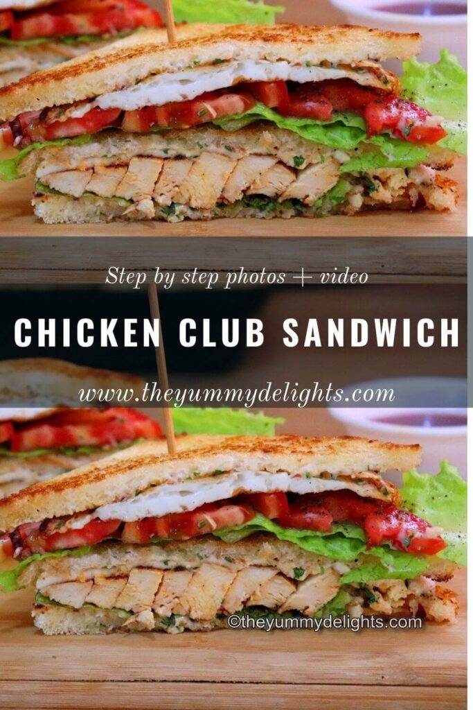 Close-up of chicken club sandwich sliced in half and placed on a board.