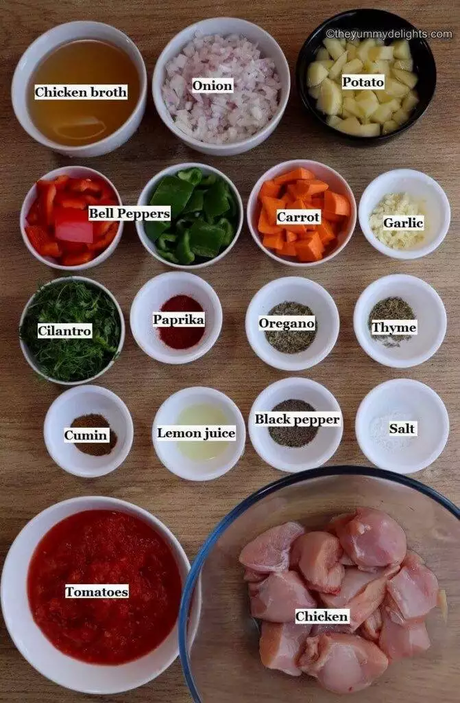 individually labeled ingredients to make mediterranean chicken stew laid out on a table.