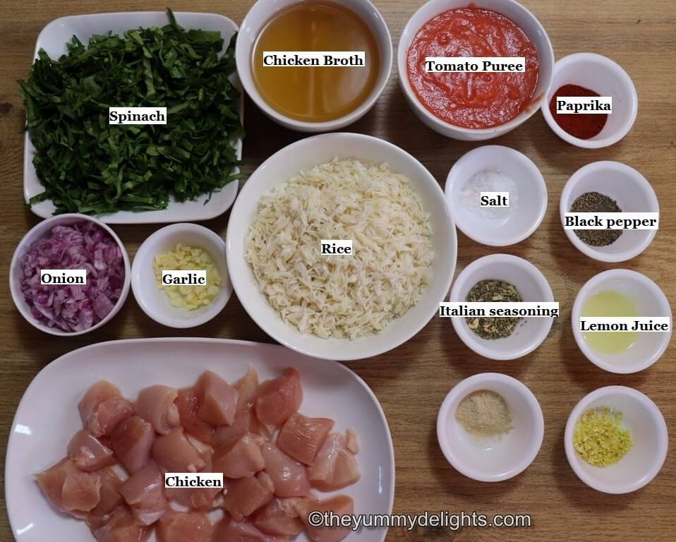 individually labeled ingredients to make chicken and rice with spinach laid out on a table