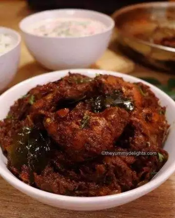 kerala chicken roast served in a white bowl.