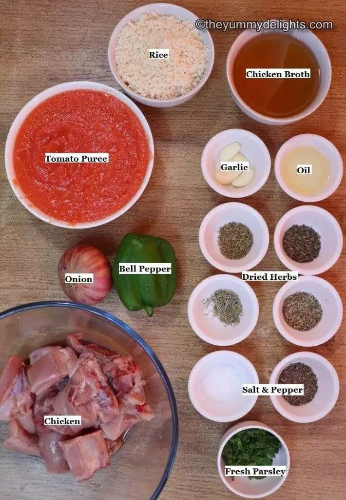 individually labeled ingredients to make   tomato chicken and rice recipe is laid out on a table.