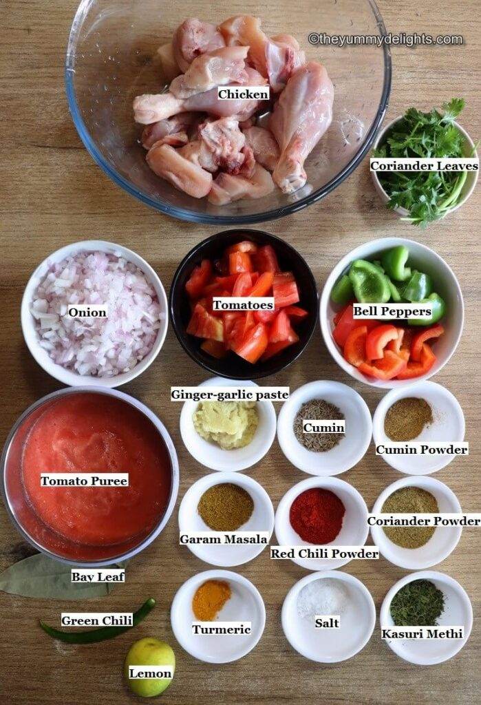 Individually labeled ingredients to make tomato chicken recipe laid out on a table.