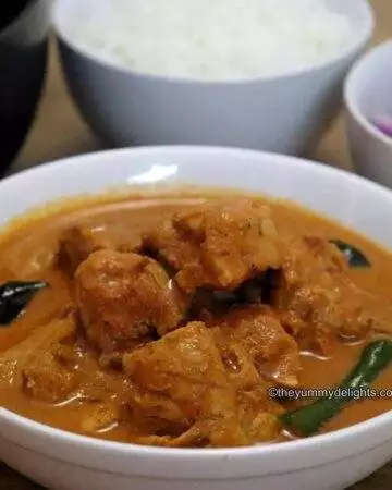 ceylon chicken curry served in a white bowl.