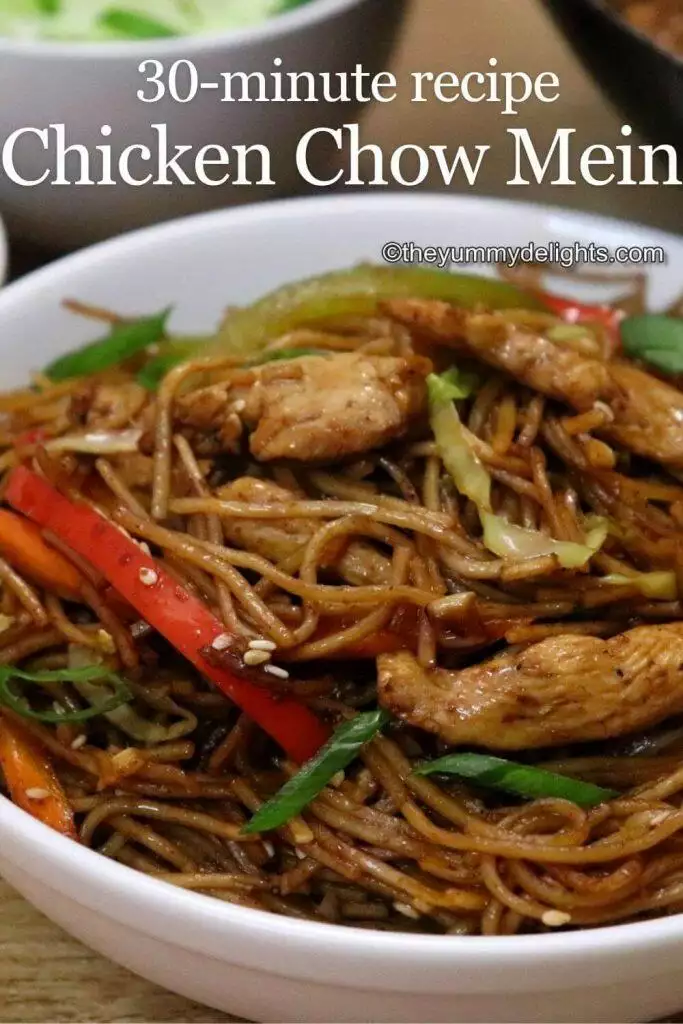 close-up of chicken chow mein served in a white bowl with text layover 30 minute recipe chicken chow mein.