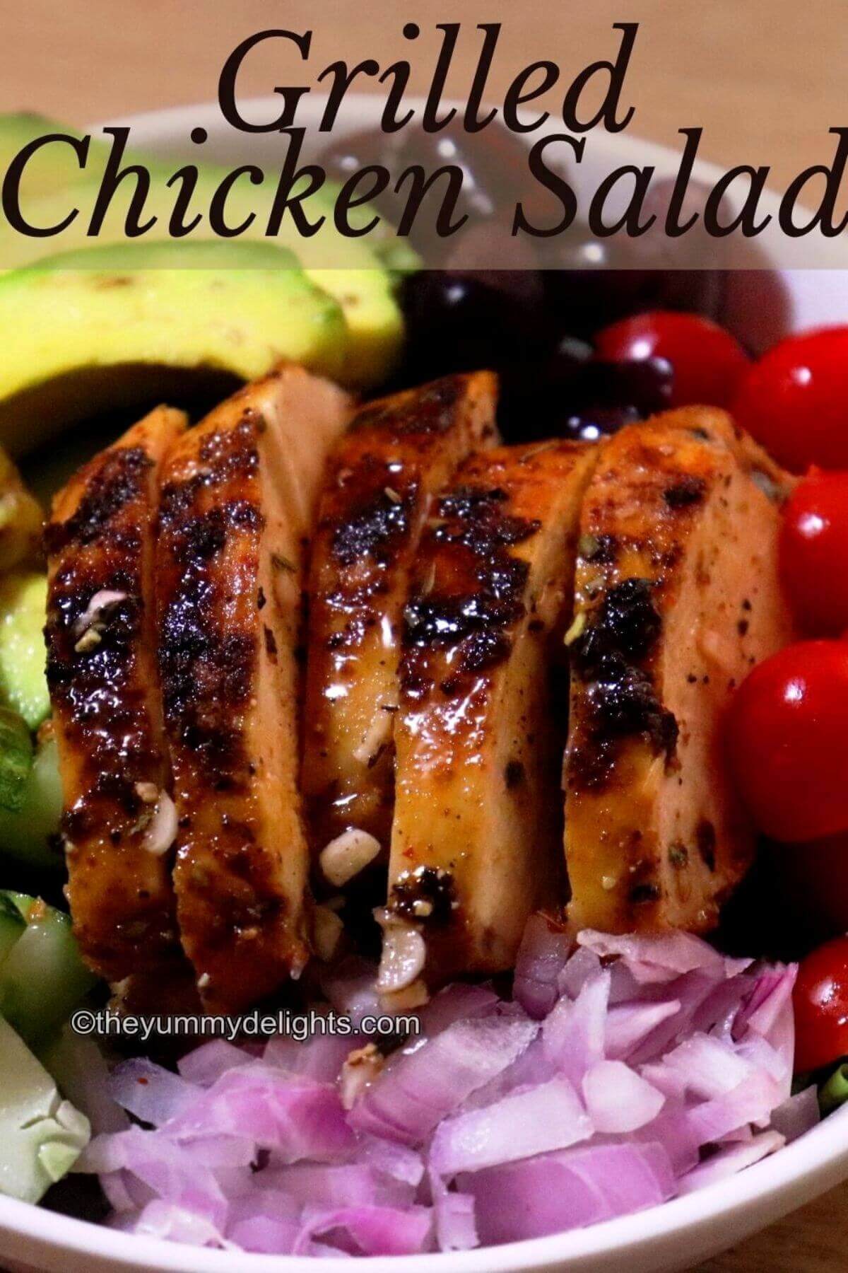close-up of grilled chicken salad recipe with text overlay.