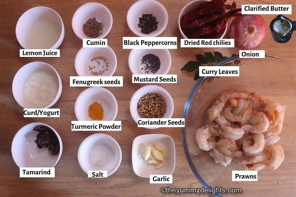 individually labeled ingredients to make prawn ghee roast are laid out on a table.