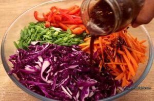 addition of asian slaw dressing to the salad.