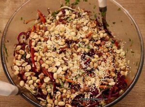 addition of roasted peanuts and sesame seeds to the asian slaw recipe.