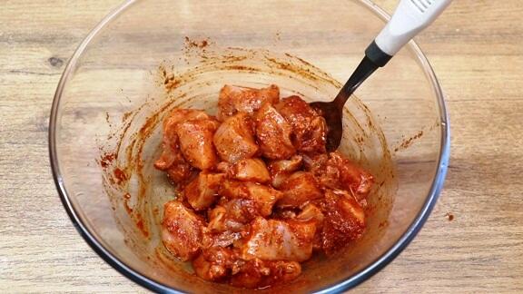 marinating the chicken with cajun seasoning, lemon juice and oil to make cajun chicken and rice.
