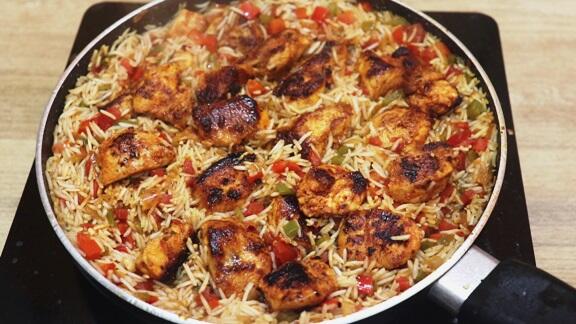 addition of chicken to the pan.