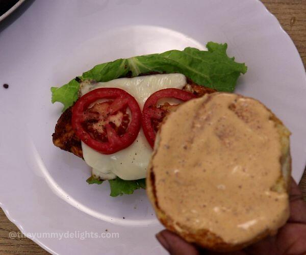 assembling chipotle chicken sandwich.