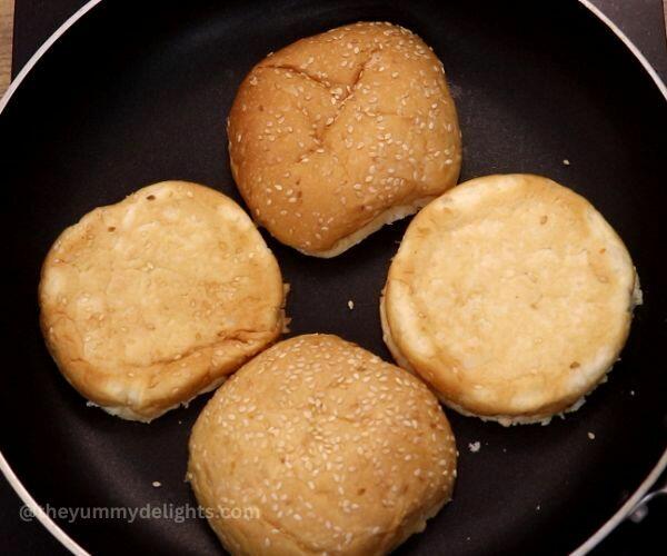 toasting buns to make chipotle chicken sandwich.