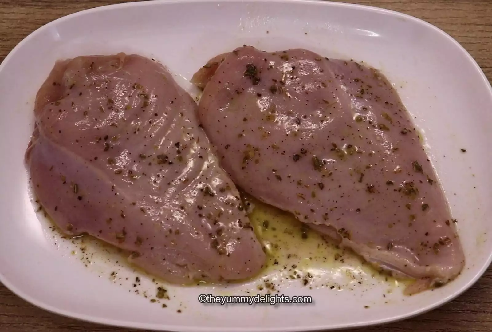 close of marinating the chicken breasts with greek dressing.
