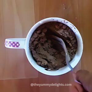 close-up of whisking all the dry ingredients to make chocolate mug cake recipe.