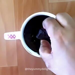 addition of chocolate in the center to create chocolate lava in mug cake.