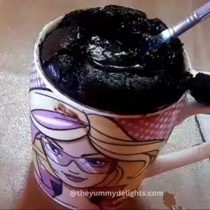 close-up of molten lava in chocolate mug cake.