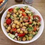 close-up od mediterranean chickpea salad in a white colored bowl.