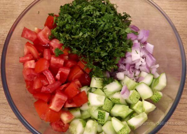 close-up of vegetables put into mixing bowl.