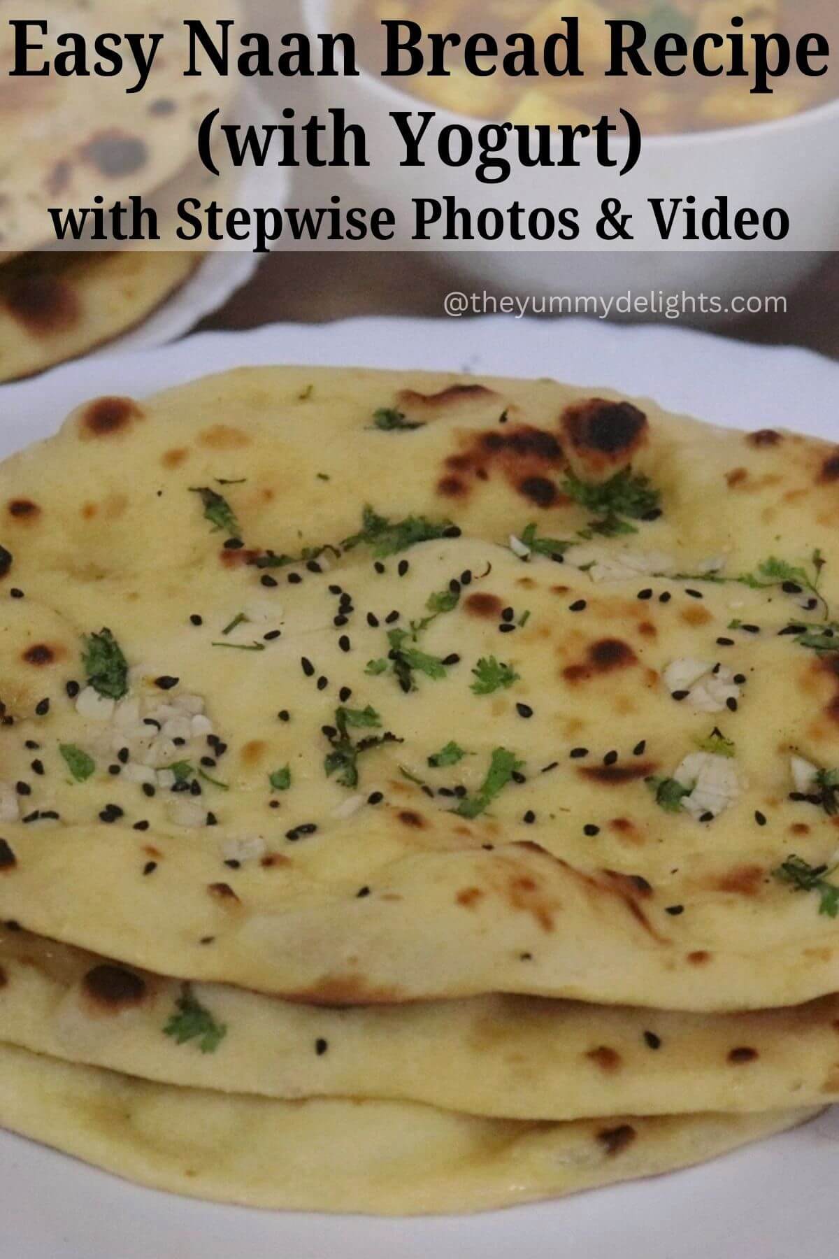 close-up of 3 garlic naan bread served on a white plate.