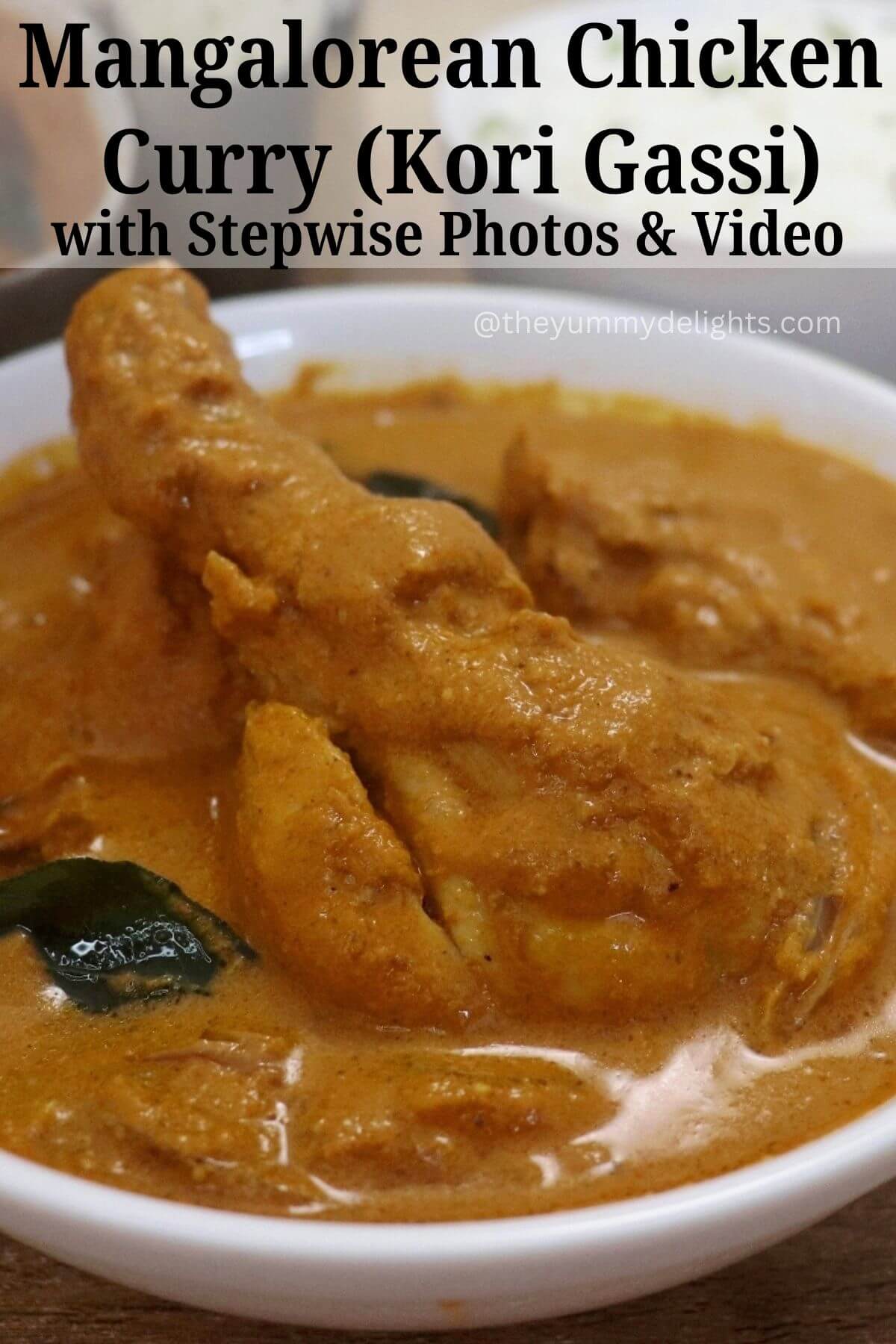 side view of mangalorean chicken curry (kori gassi) served in a white bowl.