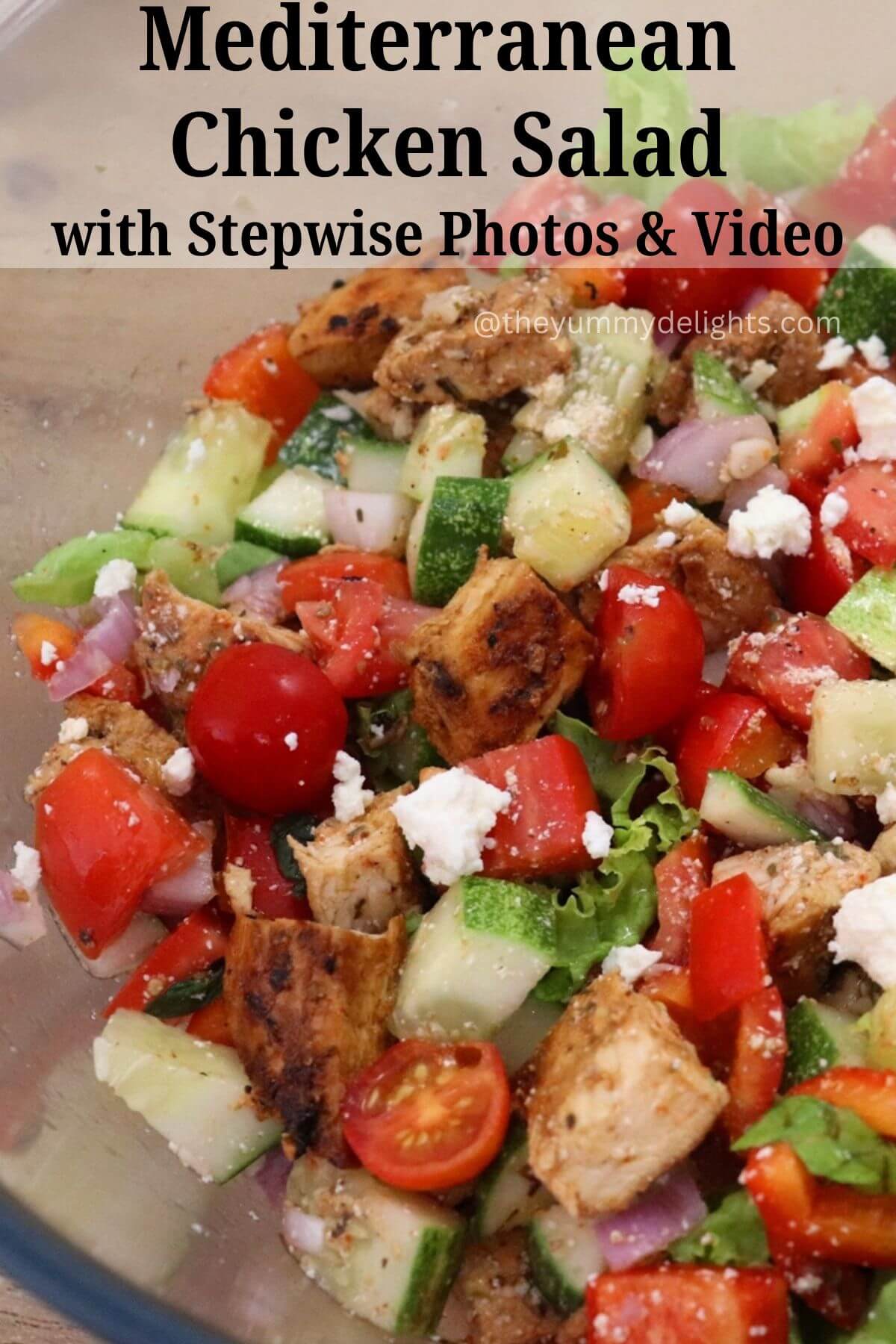 side view of mediterranean chicken salad in a glass bowl with text overlay.