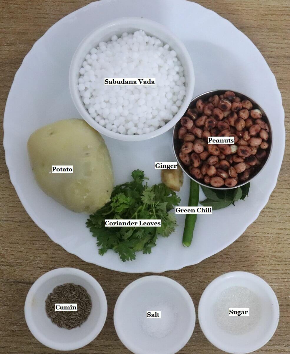 individually labeled ingredients to make sabudana vada recipe are laid out on a table.