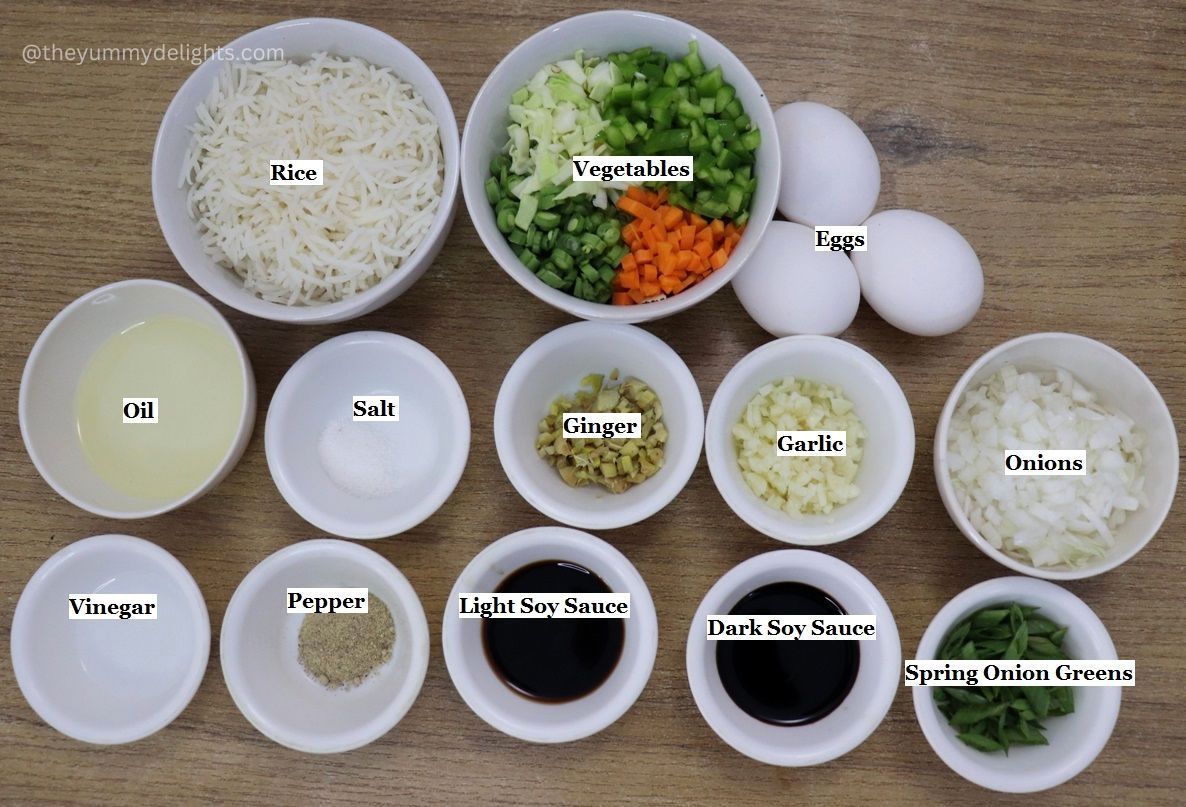 individually labeled ingredients to make vegetable egg fried rice are laid out on a table