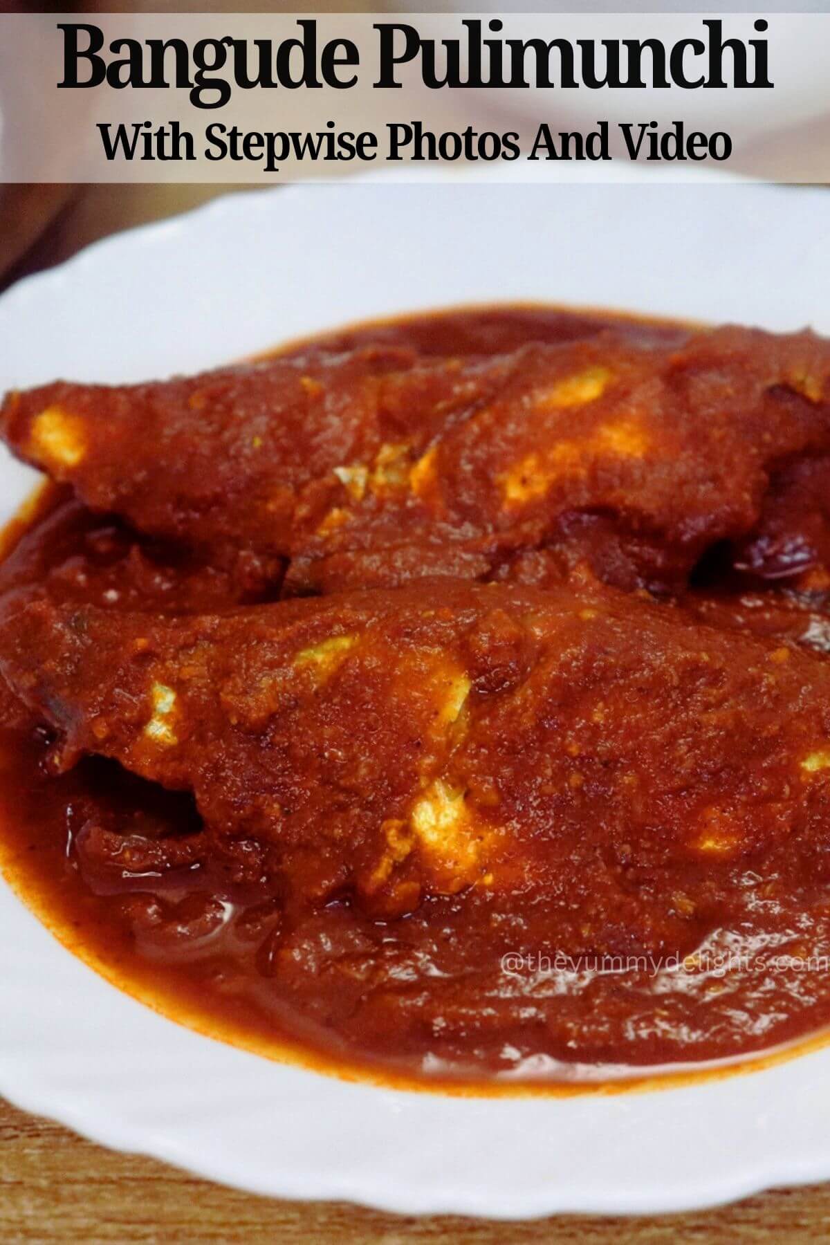 side close-up of bangude pulimunchi served in a white plate.