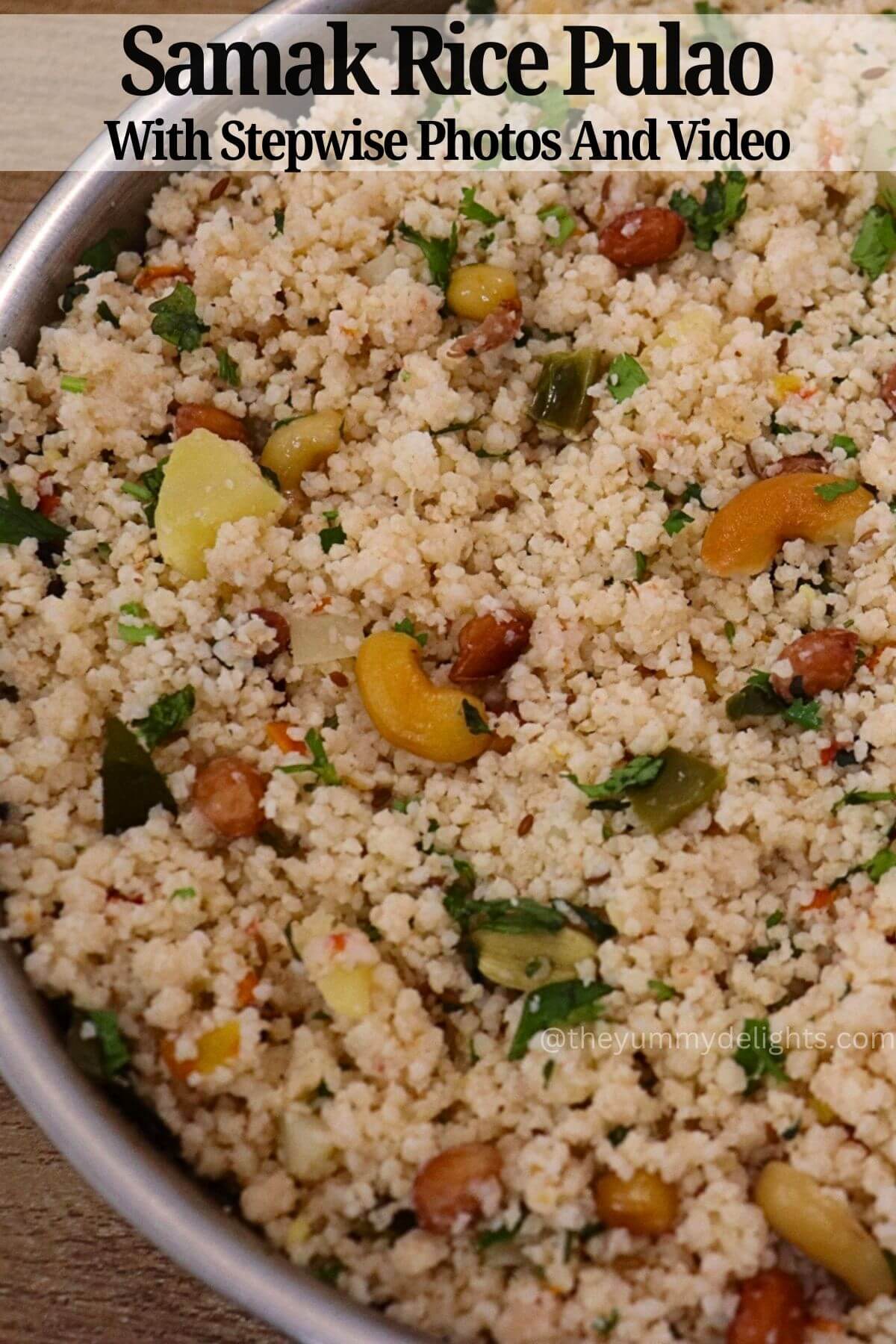 side view of samak rice pulao in a steel pan. This vrat pulao is garnished with fried cashews and peanuts.