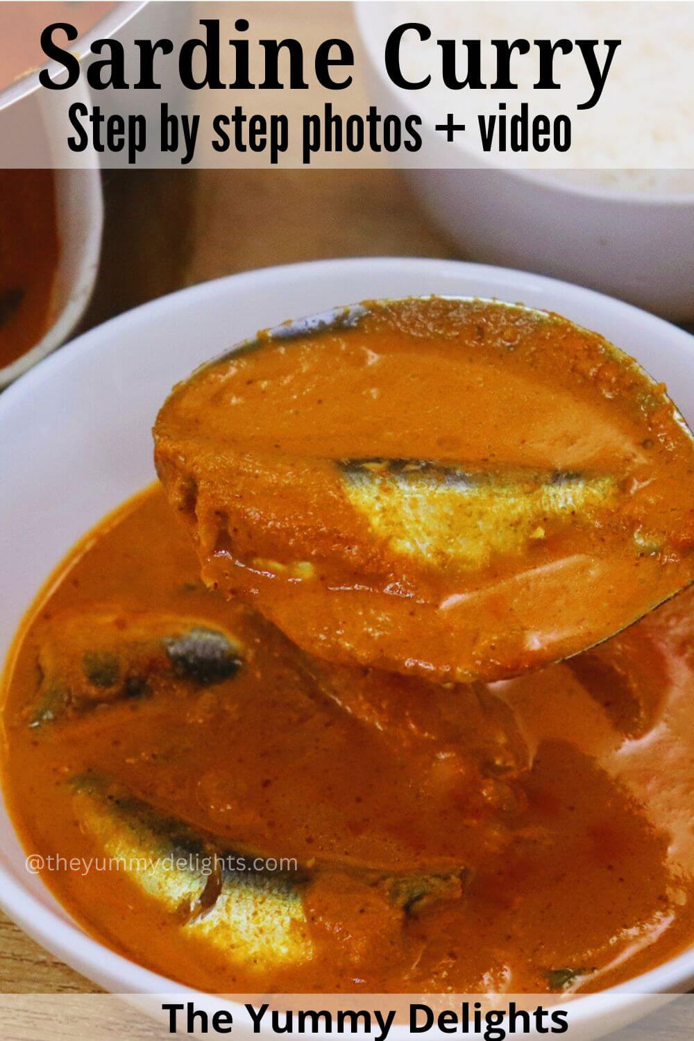 close-up of ladle full of sardine curry held over the sardine curry bowl.