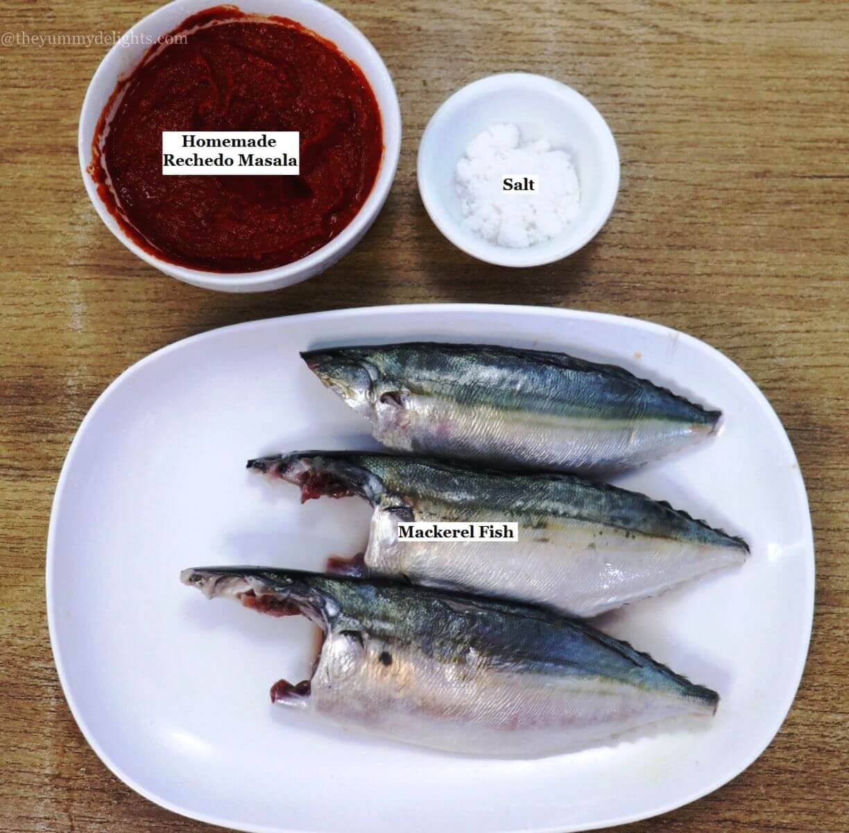 individually labelled ingredients to make recheado mackerels are laid out on a table.