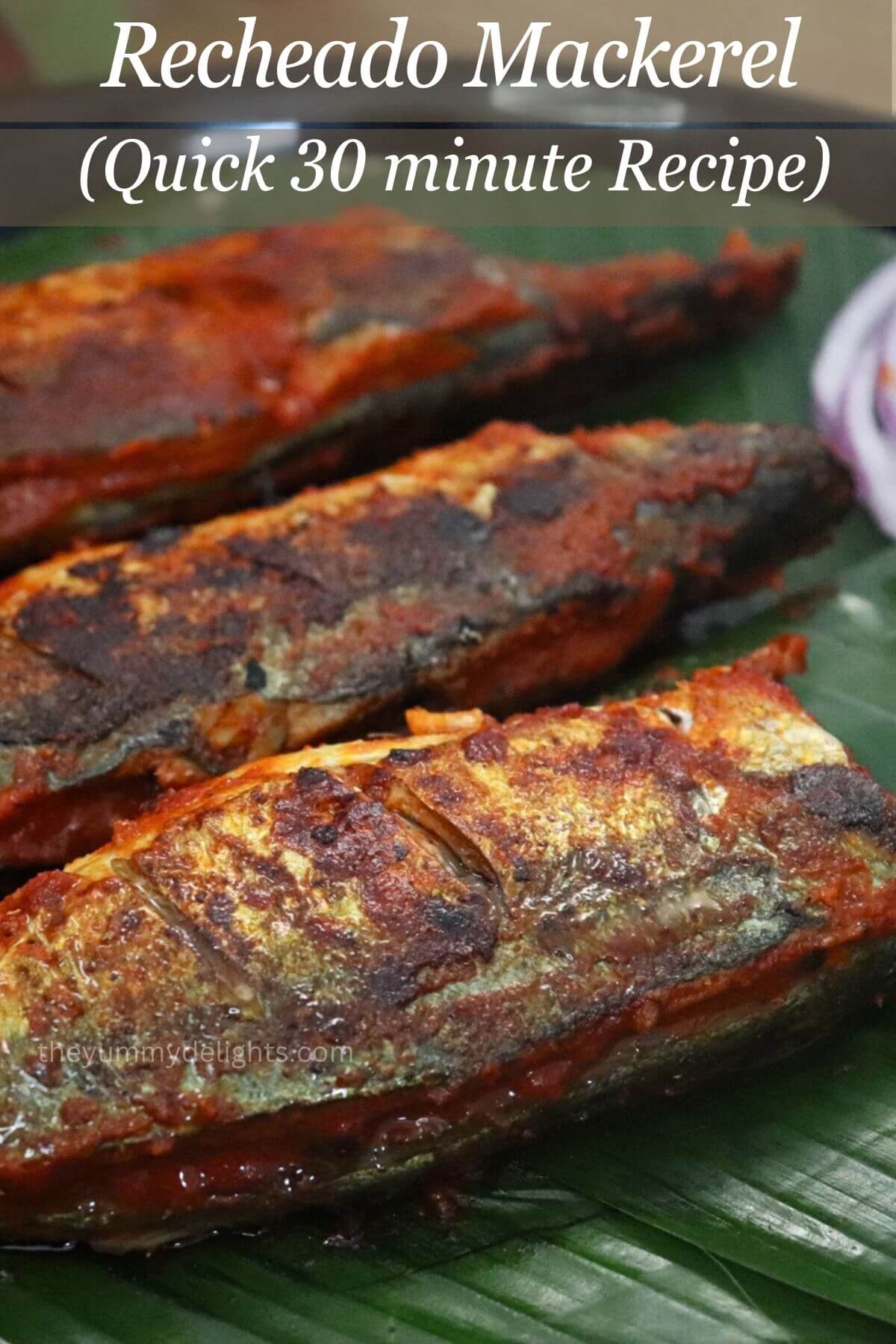 Goan-style recheado mackerels stuffed with recheado masala and fried until golden. This recheado bangda fish fry is served with onion rings and lemon wedge.