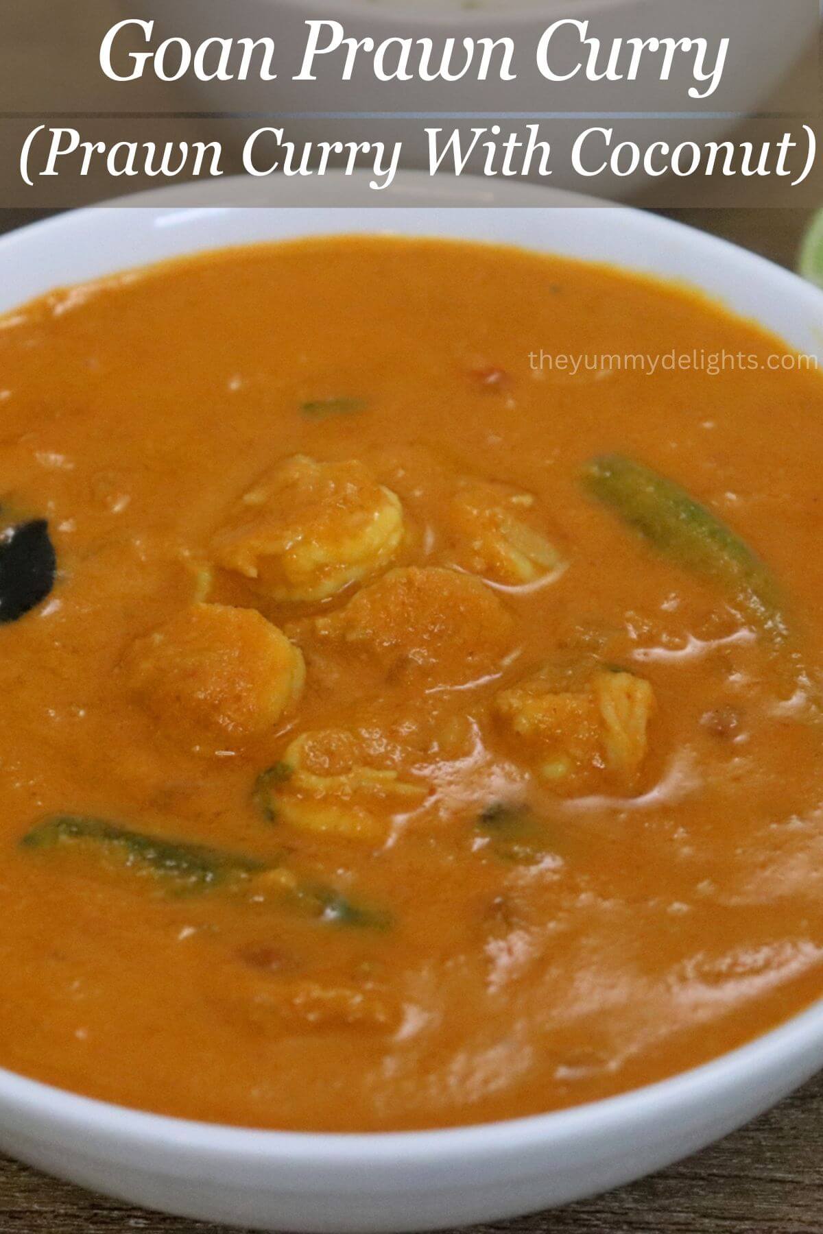 close-up of goan prawn curry served in a white bowl.