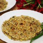 sabudana thalipeeth served on a white colored plate.