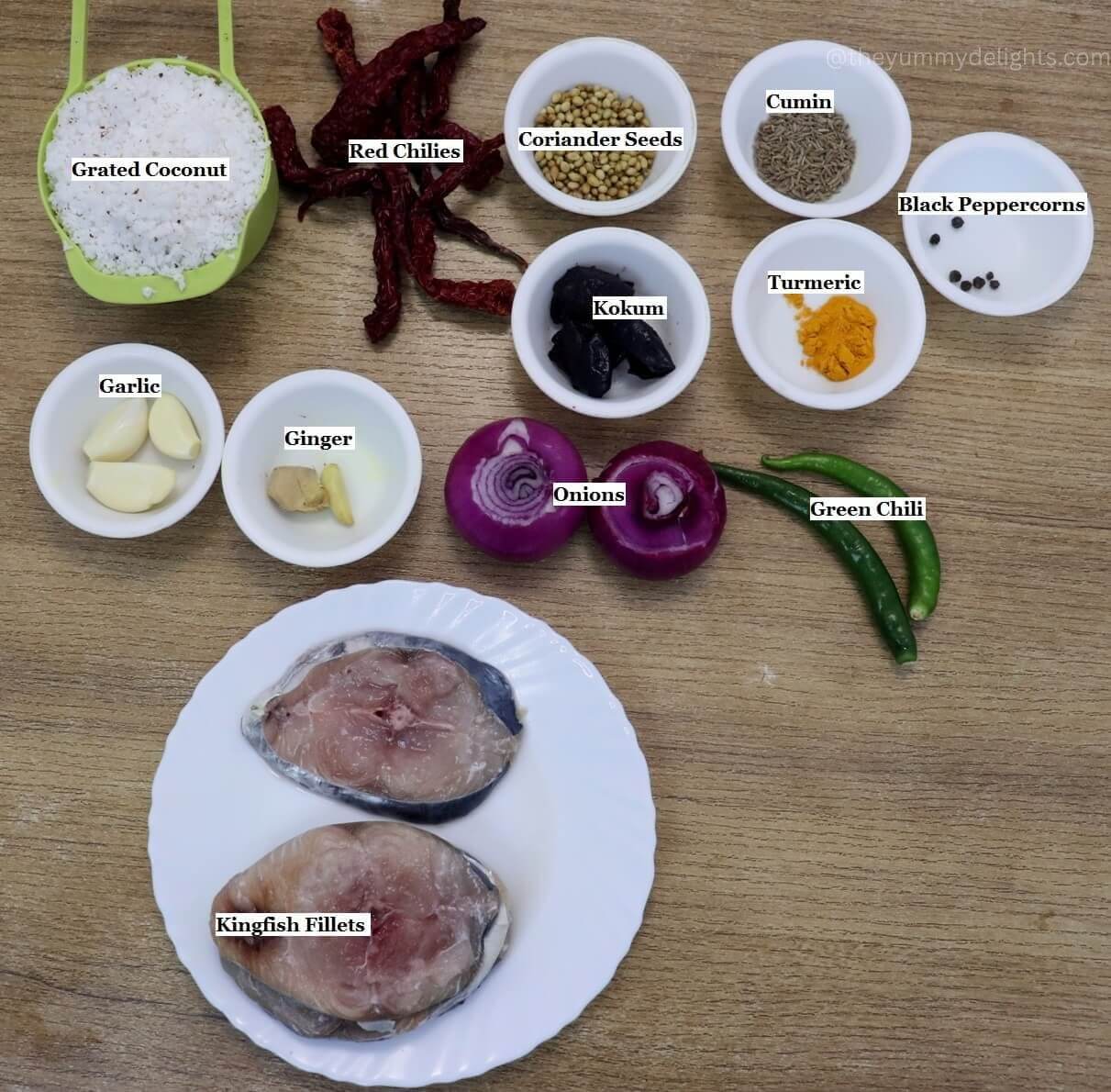 individually labeled ingredients to make kingfish curry are laid out on a table.