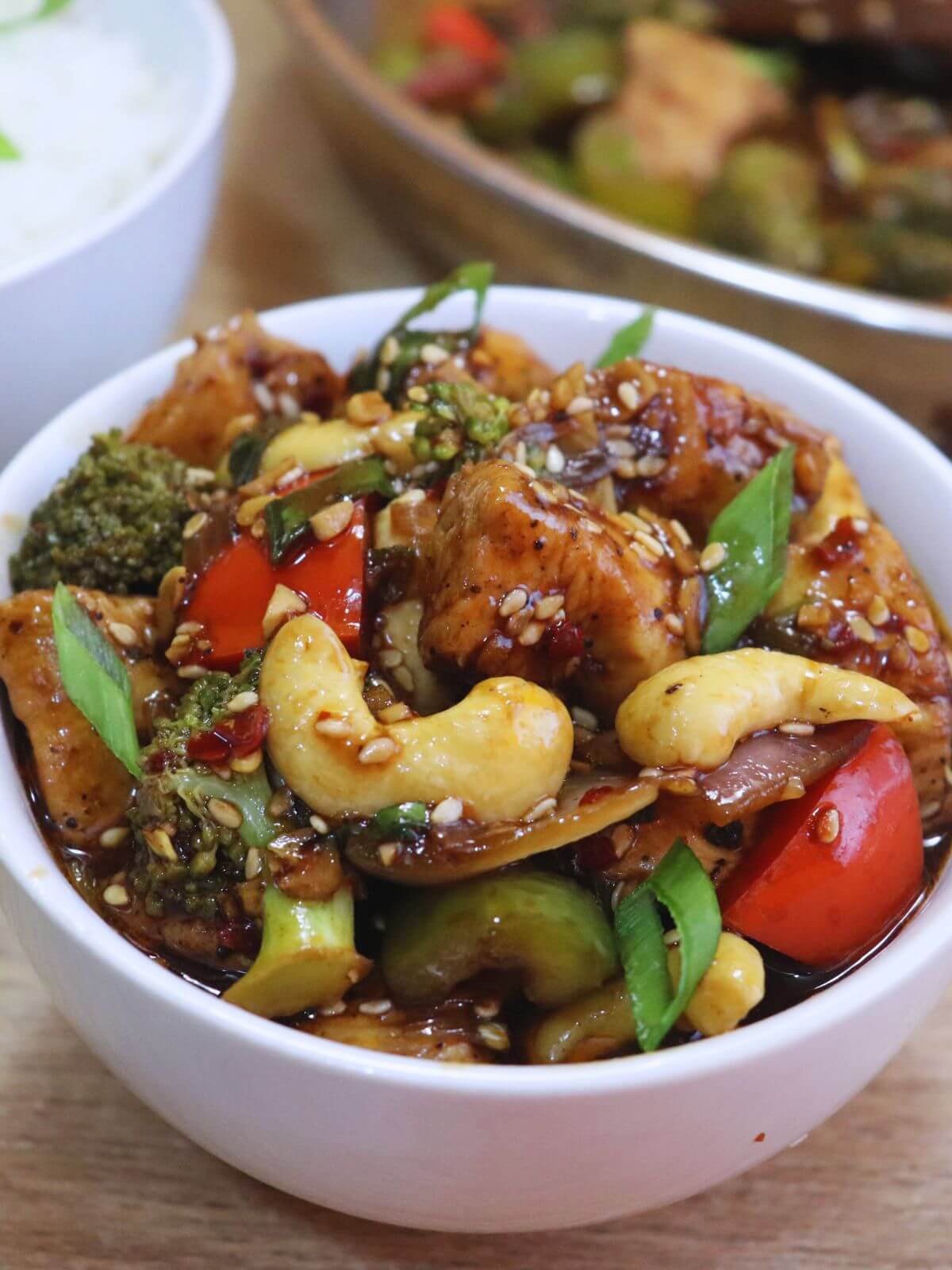a tight-close of chicken and vegetable stir fry served in a bowl.
