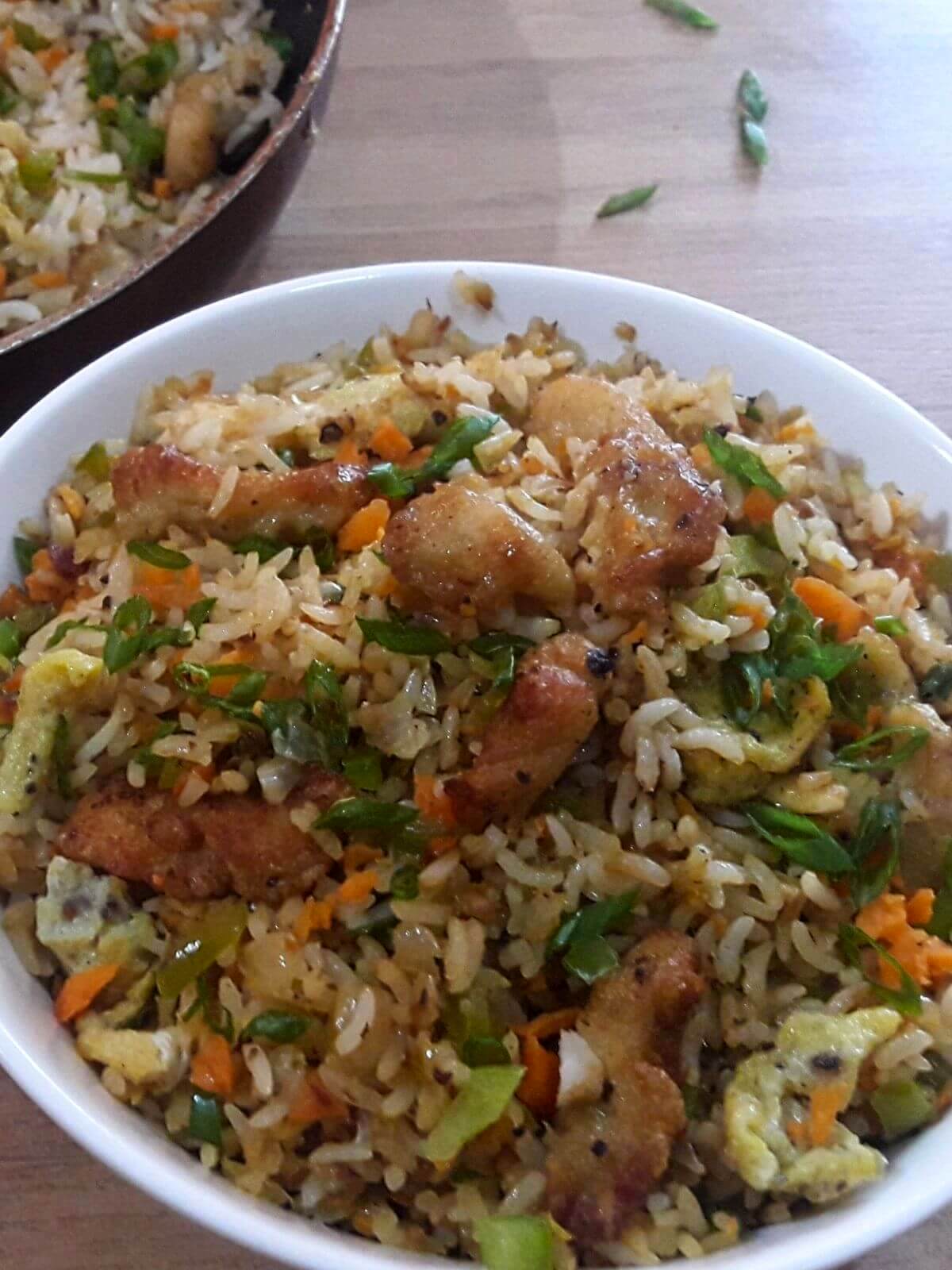 chicken fried rice served in a bowl.
