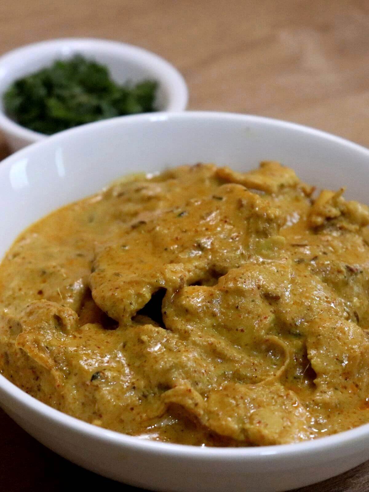 close-up of chicken pasanda served in a bowl.