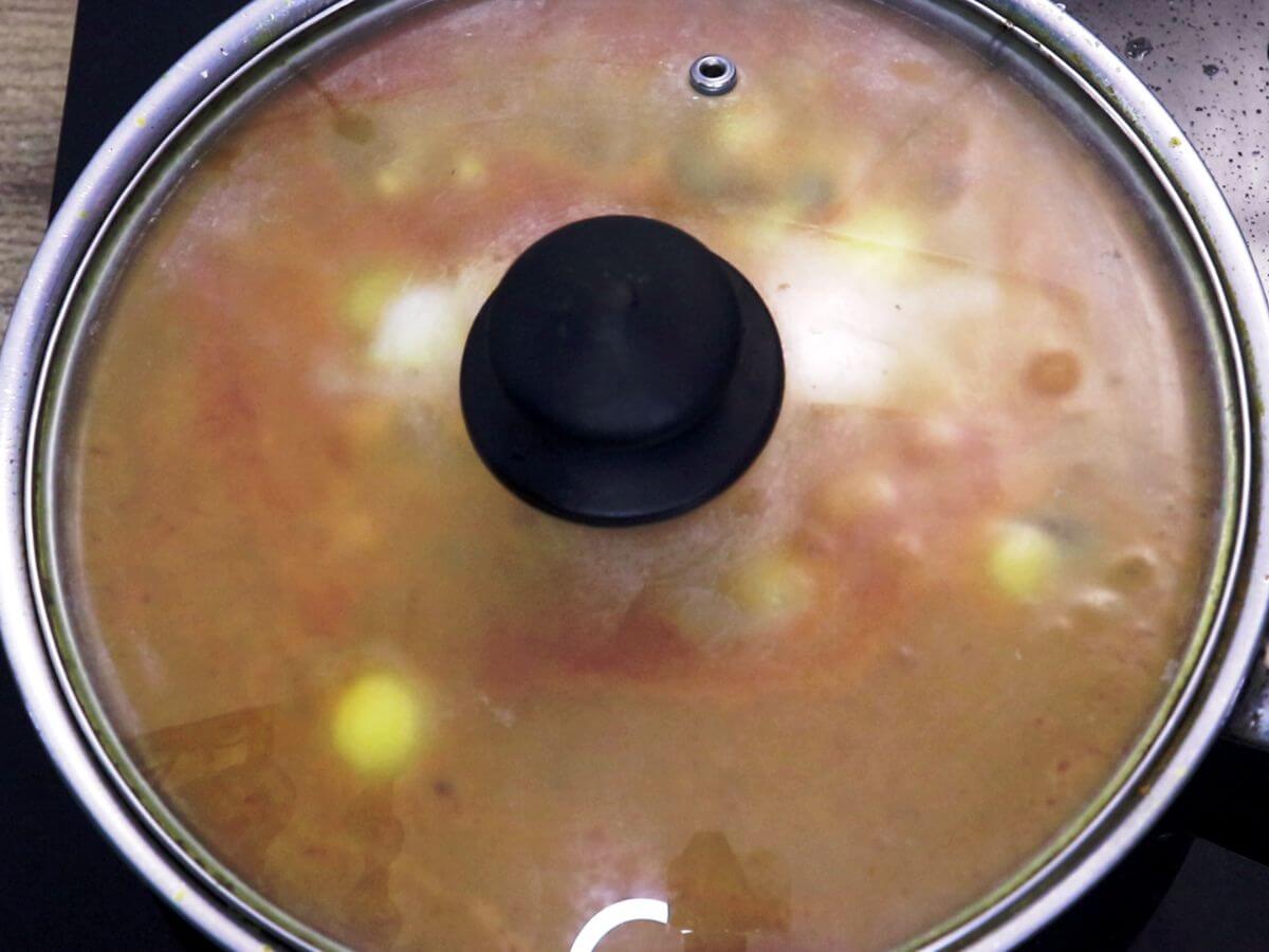 simmering the eggs in a covered pan.