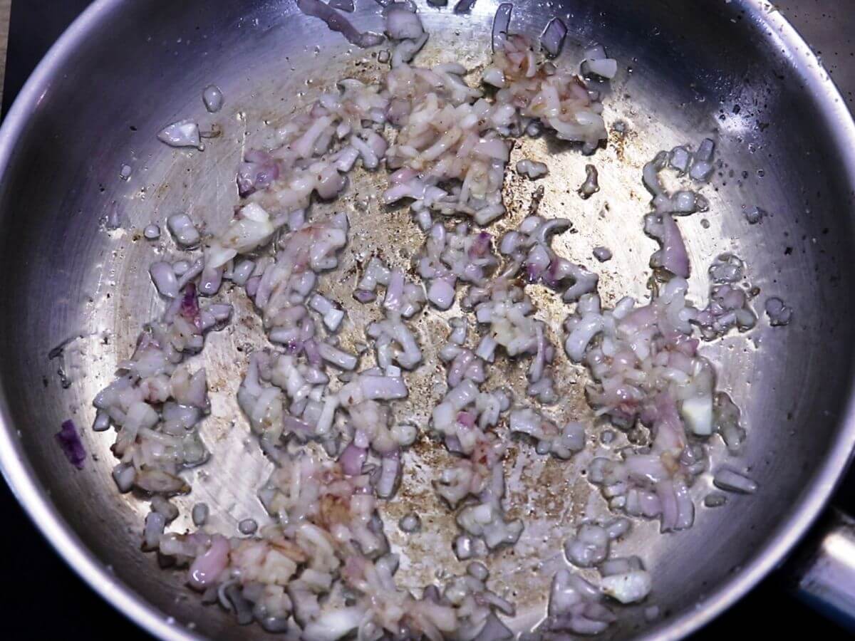 sauteing onions for making the poached egg curry.