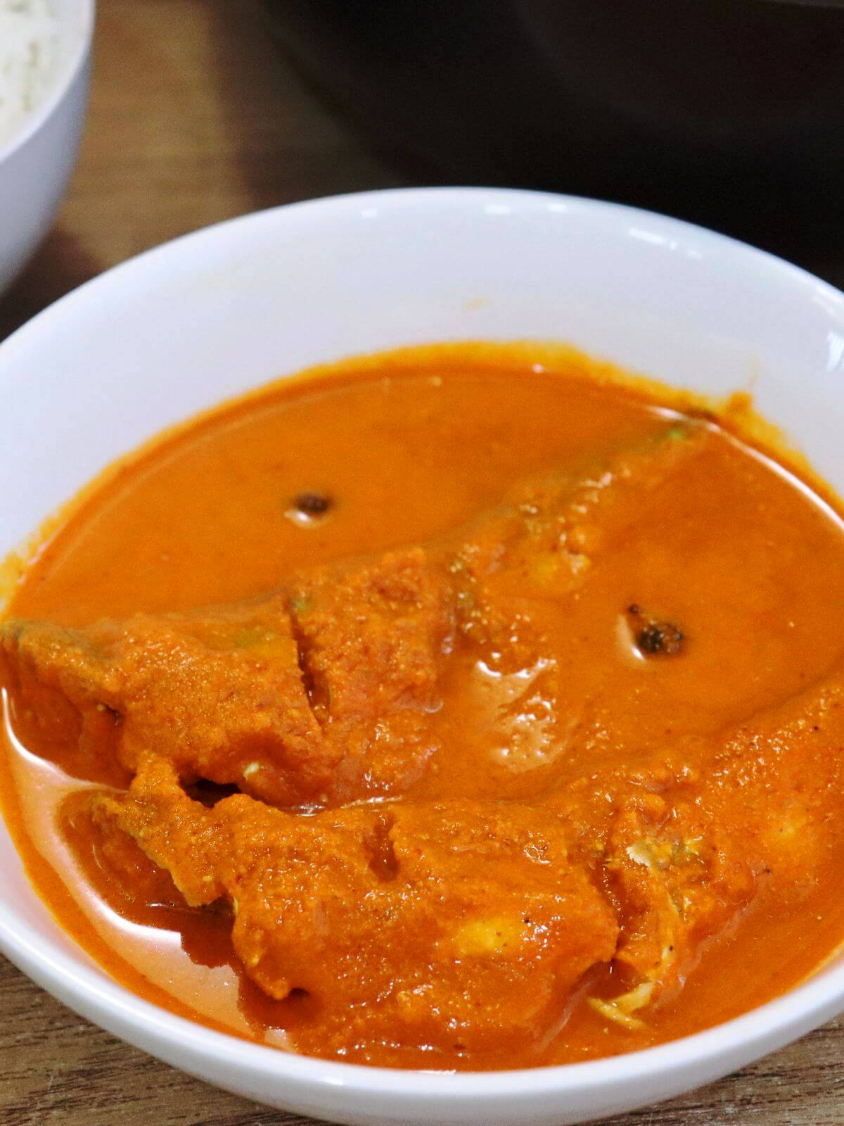 close-up of goan fish curry served in a bowl.
