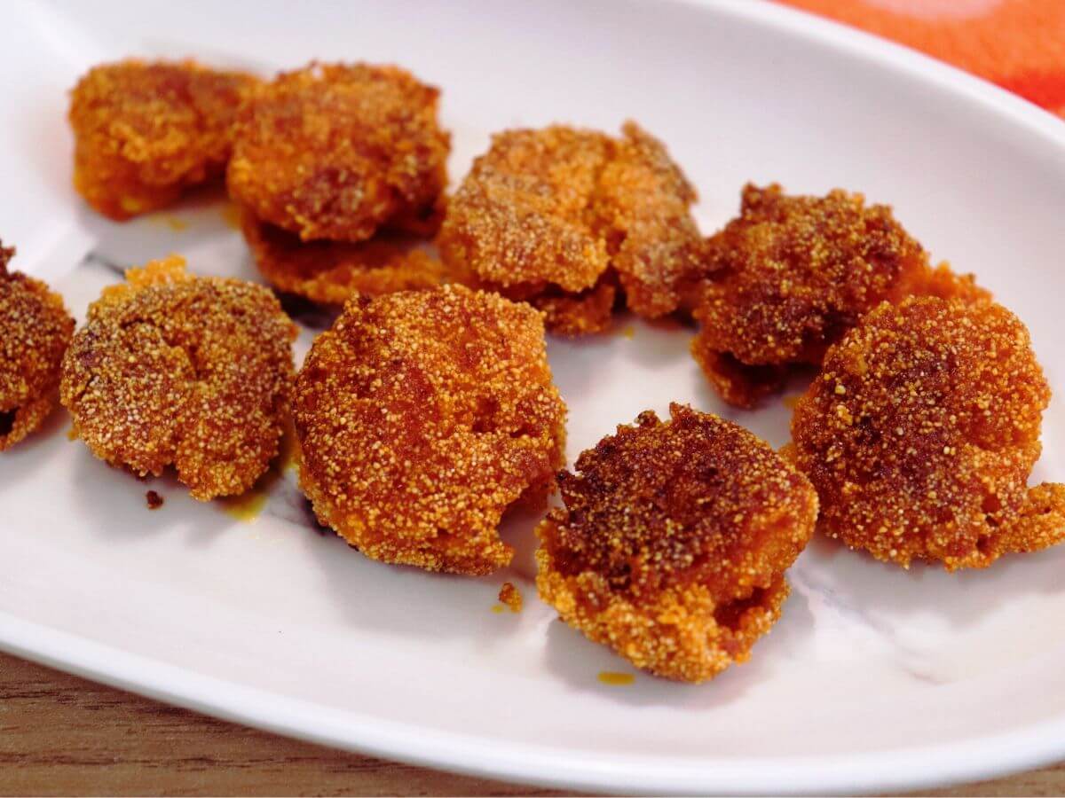 close-up of goan prawn fry served on a white plate.